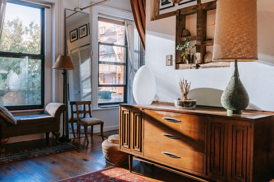 Vintage cabinet and lamps in a sunlit living room